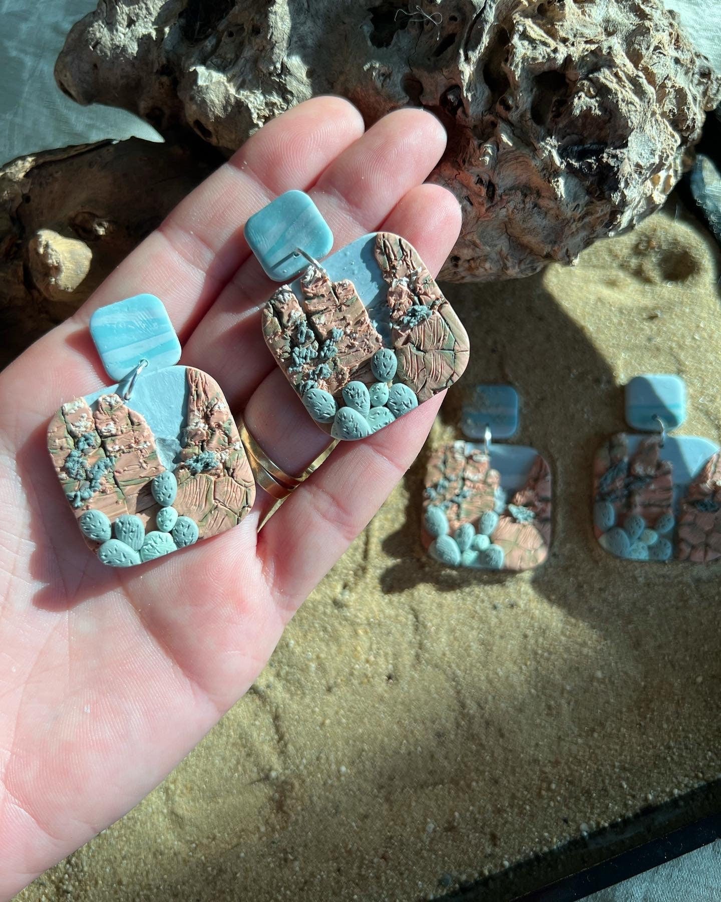 Arizona desert landscape clay earrings.