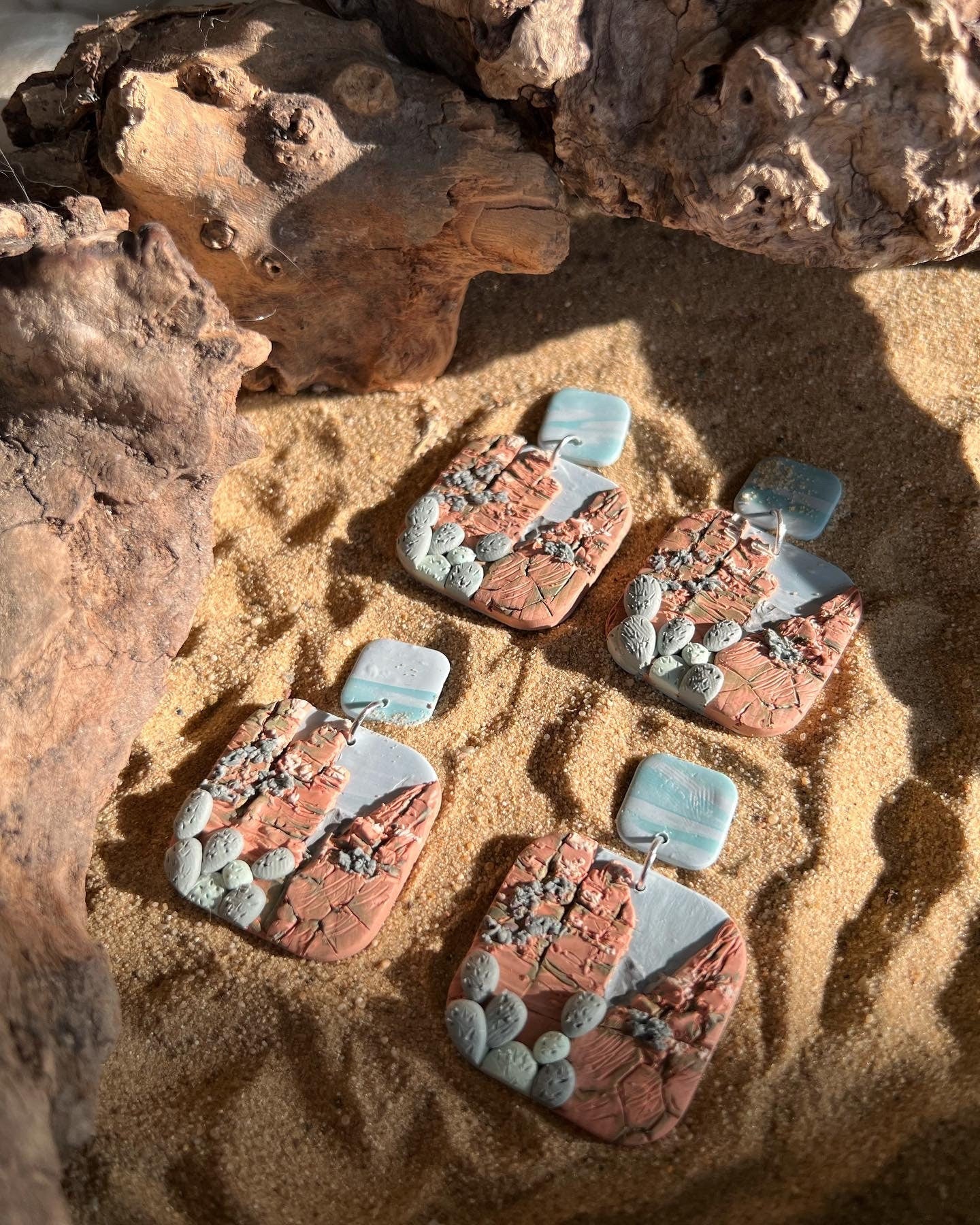 Arizona desert landscape clay earrings.